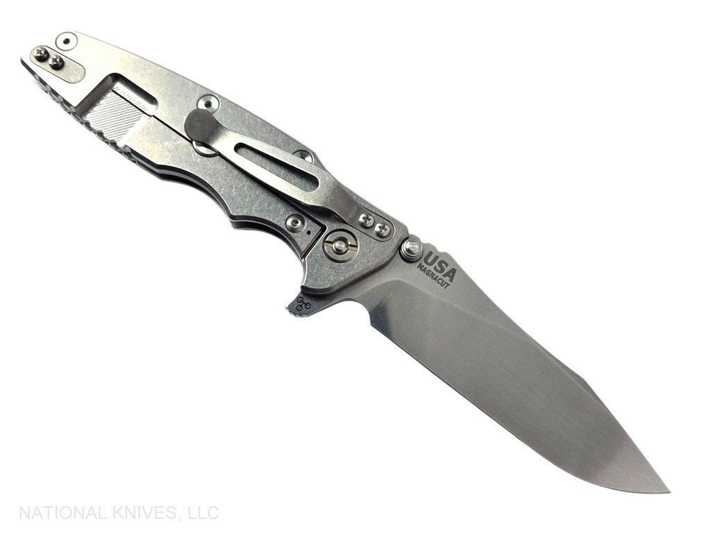 Rick Hinderer Knives Skinny Eklipse Slicer folding knife with flipper tab - shown open - lock side.  Stonewash 3.5" hollow grind MagnaCut stainless steel plain edge blade.  Black G-10 handle scale with stonewash lock side.  Model KEK35SKSLHO