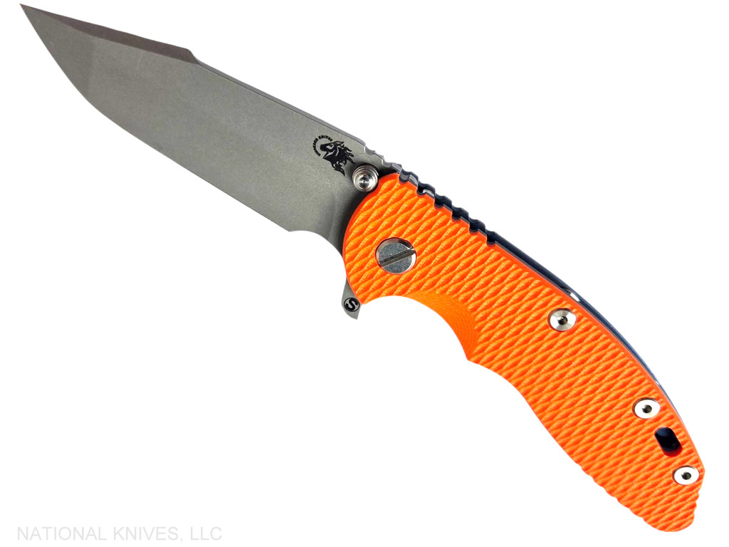 Rick Hinderer Knives XM-18 Skinny Harpoon Spanto with thumb stud and flipper tab - shown open presentation side.  Working Finish MagnaCut stainless steel plain edge blade.  Orange G-10 handle with Battle Blue lock side.  Model KXM35SKHS.