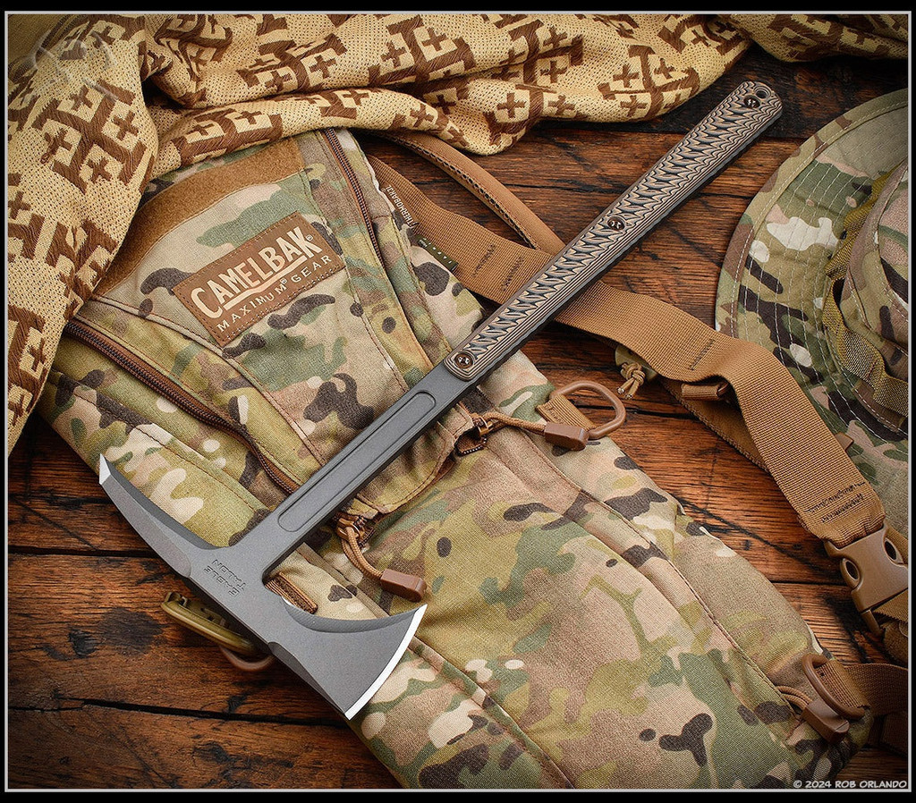 RMJ Tactical Eagle Talon limited edition tomahawk - shown out of sheath obverse.  Tungsten Cerakote S7 steel plain edge head.  Hyena Brown G-10 handle.  Model T-ET-S7-TU-HB.