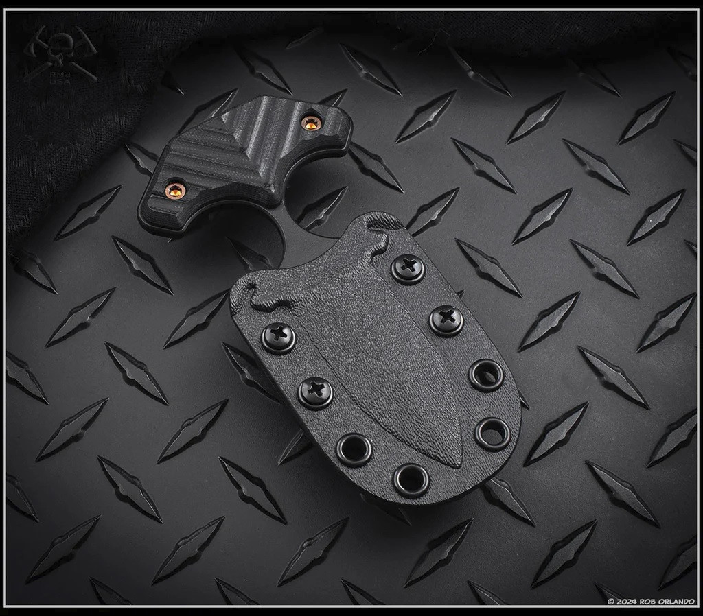 RMJ Tactical BUB Back Up Blade fixed blade knife - shown in sheath obverse.  Graphite Black Cerakote MagnaCut stainless steel plain double edge blade.  Black G-10 handle.  Model K-BUB-MC-GB-BK.