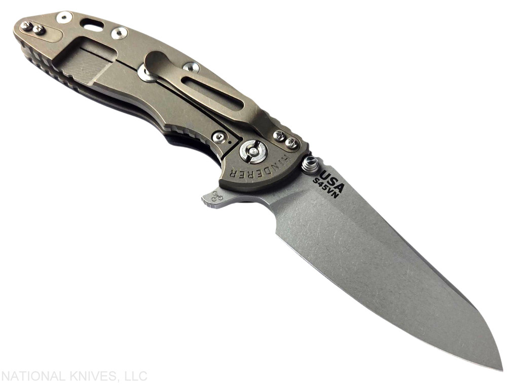 Rick Hinderer Knives XM-18 3.5" Sheepsfoot folding knife with thumb stud and flipper tab - shown open lock side.  Working Finish S45VN stainless steel plain edge blade.  Black G-10 handle with Battle Bronze lock side.  Model KXM35SHF.