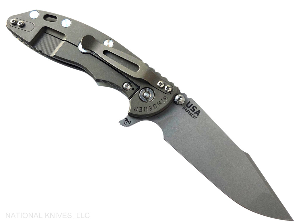 Rick Hinderer Knives XM-18 Skinny Harpoon Spanto with thumb stud and flipper tab - shown open lock side.  Working Finish MagnaCut stainless steel plain edge blade.  Translucent Green G-10 handle with Battle Bronze lock side.  Model KXM35SKHS.