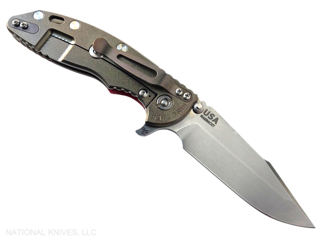 Rick Hinderer Knives XM-18 Skinny Harpoon Spanto with thumb stud and flipper tab - shown open lock side.  Stonewashed MagnaCut stainless steel plain edge blade.  Red G-10 handle with stonewashed bronze lock side.  Model KXM35SKHS.