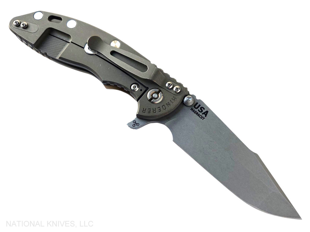 Rick Hinderer Knives XM-18 3.5" Harpoon Spanto folding knife with thumb stud and flipper tab - shown open lock side.  Working Finish MagnaCut stainless steel plain edge blade.  Coyote G-10 handle with Battle Bronze lock side.  Model KXM35HS.