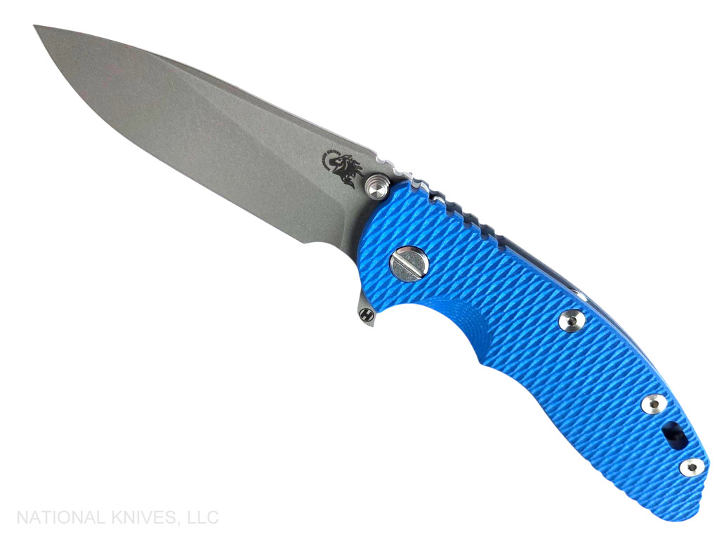 Rick Hinderer Knives XM-18 3.5" Slicer Hollow Grind folding knife with thumb stud and flipper tab - shown open presentation side.  Working Finish 20CV stainless steel plain edge blade.  Blue G-10 handle with Battle Blue lock side.  Model KXM35SLHO.