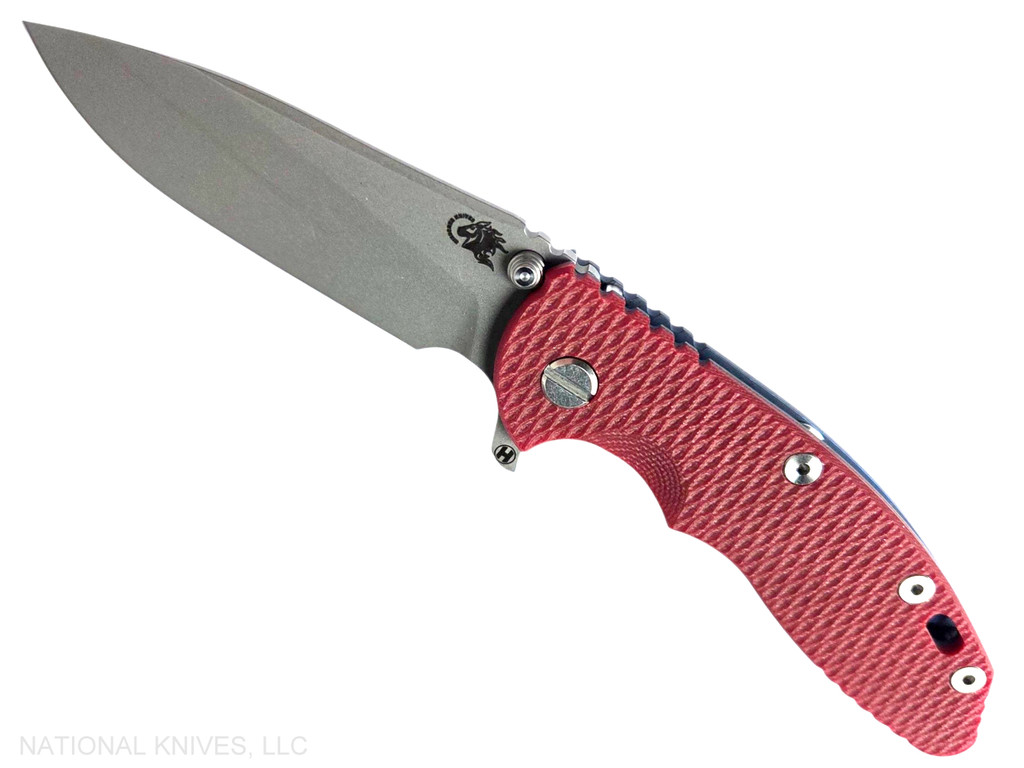 Rick Hinderer Knives XM-18 3.5" Slicer Hollow Grind folding knife with thumb stud and flipper tab - shown open presentation side.  Working Finish 20CV stainless steel plain edge blade.  Red G-10 handle with Battle Blue lock side.  Model KXM35SLHO.