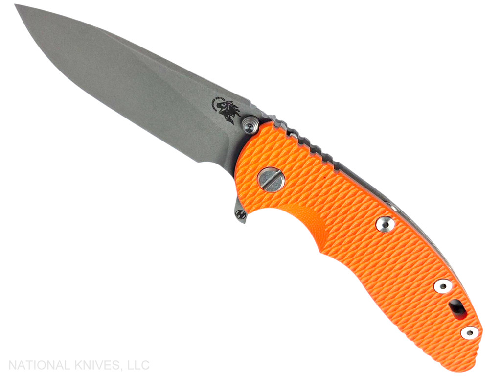Rick Hinderer Knives XM-18 3.5" Slicer Hollow Grind folding knife with thumb stud and flipper tab - shown open presentation side.  Working Finish 20CV stainless steel plain edge blade.  Orange G-10 handle with Working Finish lock side.  Model KXM35SLHO.