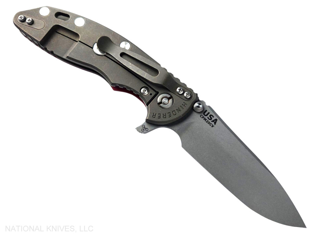 Rick Hinderer Knives XM-18 3.5" Slicer Hollow Grind folding knife with thumb stud and flipper tab - shown open lock side.  Working Finish 20CV stainless steel plain edge blade.  Red G-10 handle with Battle Bronze lock side.  Model KXM35SLHO.