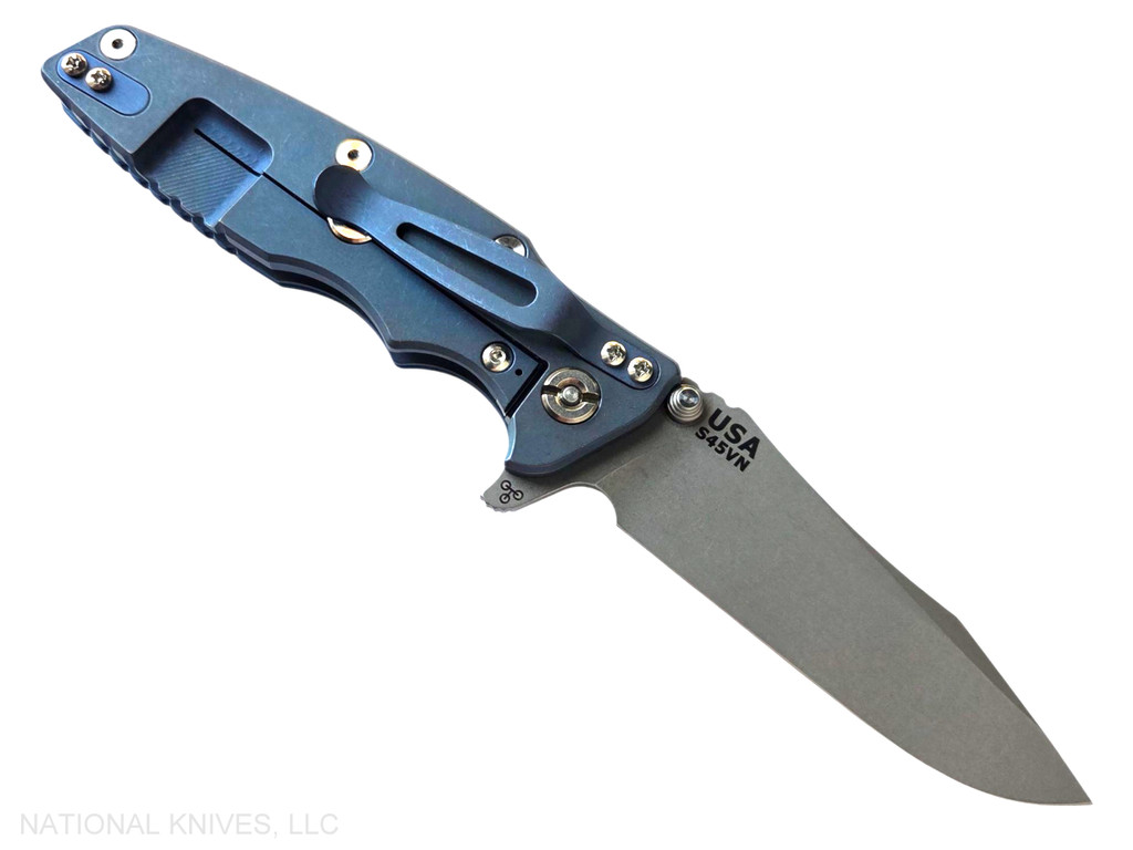 Rick Hinderer Knives Eklipse Spear Point folding knife with flipper tab and thumb stud - shown open lock side.  Working Finish S45VN stainless steel plain edge blade.  Blue - black G-10 handle with Battle Blue lock side.  Model KEK35SPE.