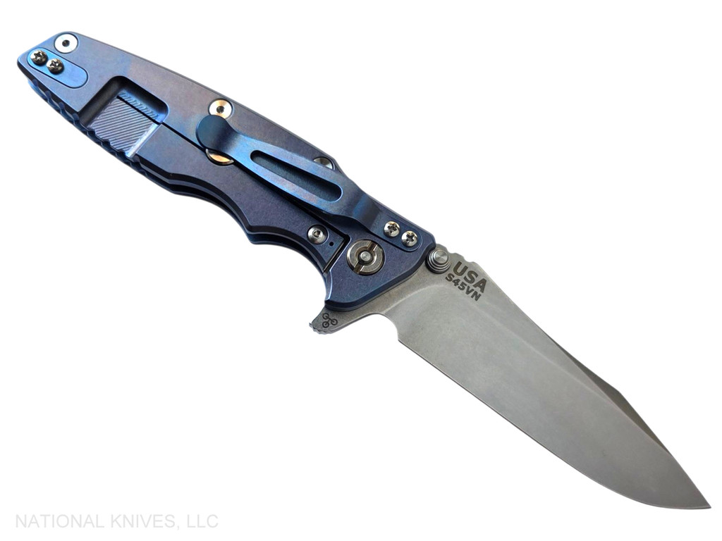 Rick Hinderer Knives Eklipse Spear Point folding knife with flipper tab and thumb stud - shown open lock side.  Stonewash S45VN stainless steel plain edge blade.  Black G-10 handle with stonewash blue lock side.  Model KEK35SPE.