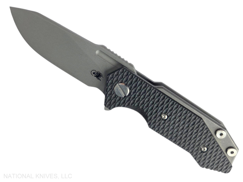 Rick Hinderer Knives Half Track Slicer folding knife with flipper tab - shown open presentation side.  Working Finish MagnaCut stainless steel plain edge blade.  Black G-10 handle with Working Finish titanium lock side.  Model KHTSLI.