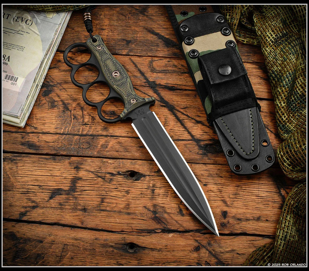 RMJ Tactical Trench Raider - shown out of sheath obverse. Graphite Black Cerakote 3V steel double plain edge blade.  Dirty Olive G-10 handle scales.  Model K-TR-3V-GB-DO-BWD.
