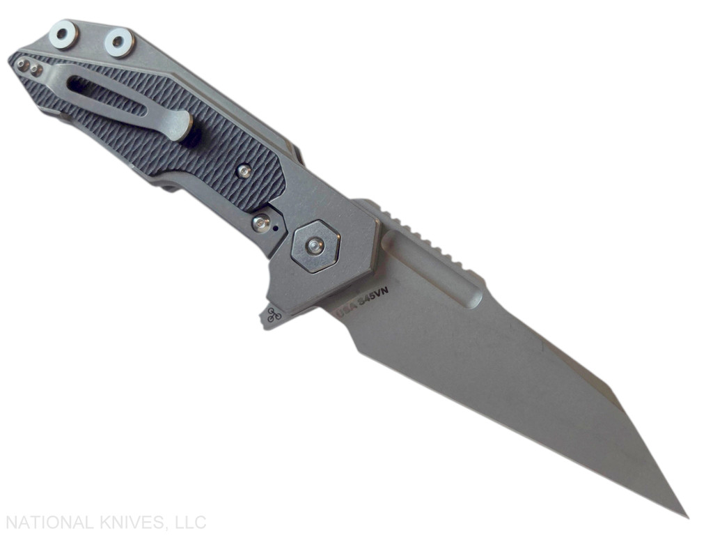 Rick Hinderer Knives Full Track Wharncliffe folding knife with flipper tab - shown open lock side.  Working Finish S45VN stainless steel plain edge blade.  Working Finish titanium with black G-10 scales.  Model KFTRWC.
