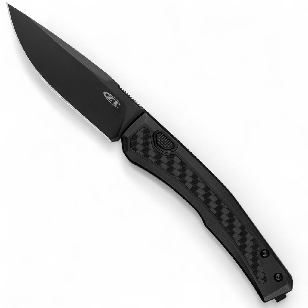 Zero Tolerance 0556BLK push button automatic knife - open - button side.  Black 3.35" MagnaCut stainless steel plain edge blade.  Black titanium handle with black carbon fiber inlay.  Model 0556BLK.