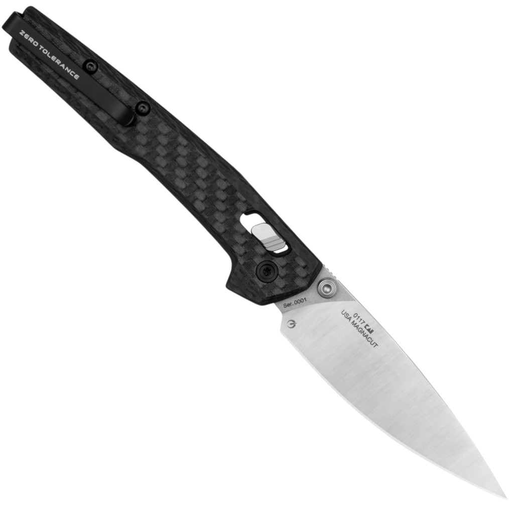 Zero Tolerance 0117 folding knife with thumb studs - shown open pocket clip side.  2-Tone MagnaCut stainless steel plain edge blade.  Carbon Fiber handle with button lock.  Model 0117.