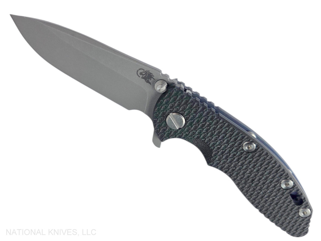 Rick Hinderer Knives XM-18 3.25" Spear Point folding knife with thumb stud and flipper tab - shown open presentation side.  Working Finish S45VN stainless steel plain edge blade.  Black G-10 handle with Battle Blue lock side.  Model KXM325SPE.
