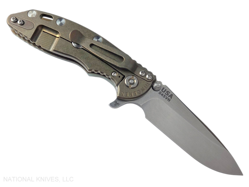 Rick Hinderer Knives XM-18 3.25" Spear Point folding knife with thumb stud and flipper tab - shown open lock side.  Stonewash S45VN stainless steel plain edge blade.  Translucent Green G-10 handle with stonewash bronze lock side.  Model KXM325SPE.