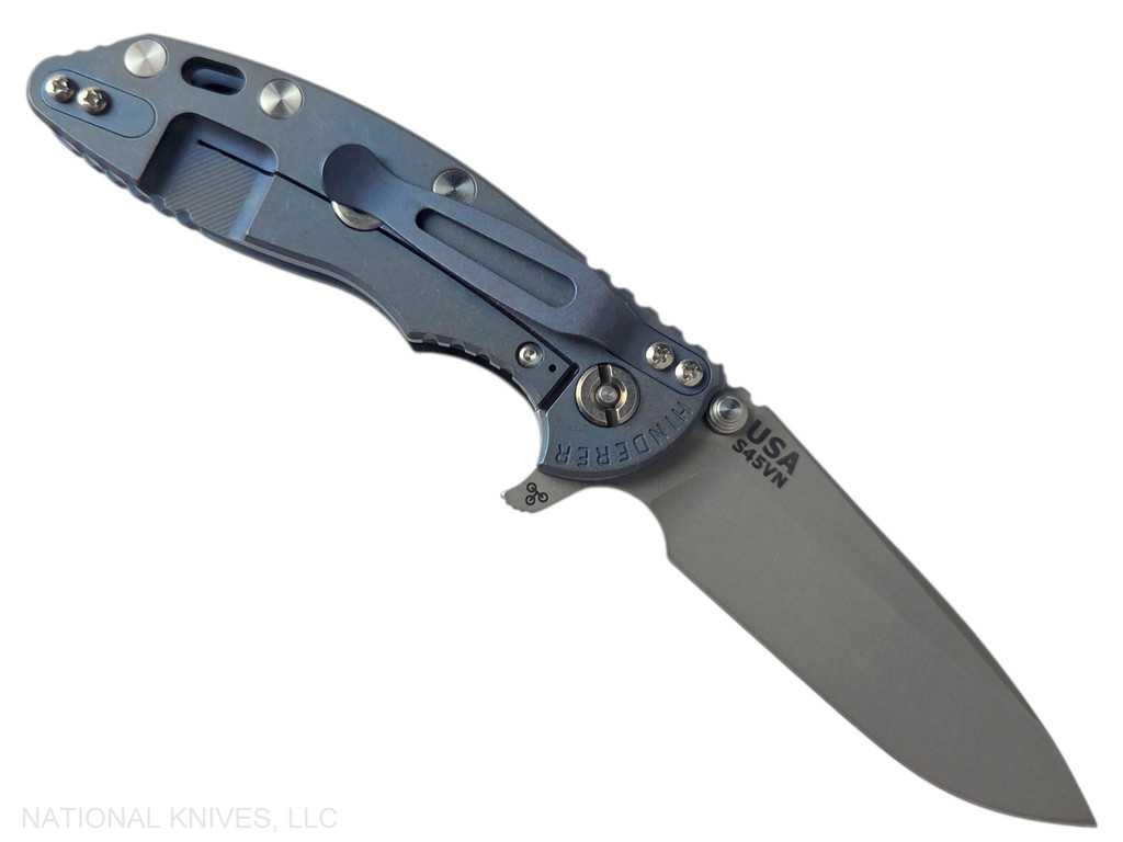 Rick Hinderer Knives XM-18 3.25" Spear Point folding knife with thumb stud and flipper tab - shown open lock side.  Working Finish S45VN stainless steel plain edge blade.  Blue - black G-10 handle with Battle Blue lock side.  Model KXM325SPE.
