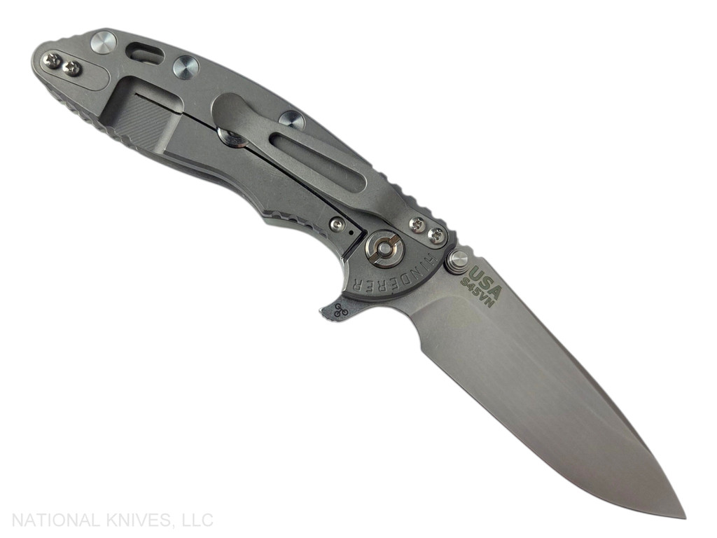 Rick Hinderer Knives XM-18 3.25" Spear Point folding knife with thumb stud and flipper tab - shown open lock side.  Stonewash S45VN stainless steel plain edge blade.  Translucent Green G-10 handle with Working Finish lock side.  Model KXM325SPE.