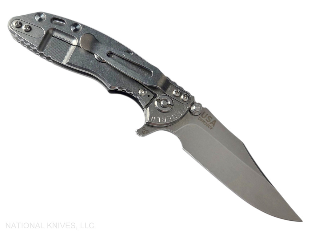 Rick Hinderer Knives XM-18 3.0" Bowie folding knife with thumb stud and flipper tab - shown open lock side.  Stonewash 20CV stainless steel plain edge blade.  Black G-10 handle with stonewashed lock side.  Model KXM30BOW.