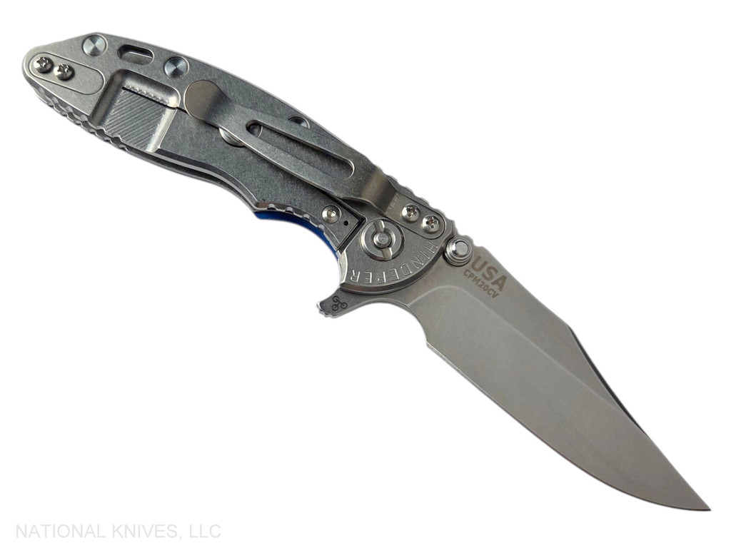 Rick Hinderer Knives XM-18 3.0" Bowie folding knife with thumb stud and flipper tab - shown open lock side.  Stonewash 20CV stainless steel plain edge blade.  Blue - black G-10 handle with stonewashed lock side.  Model KXM30BOW.