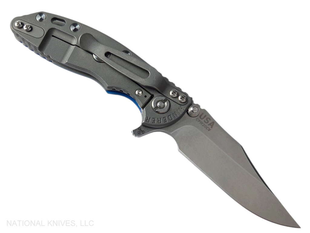 Rick Hinderer Knives XM-18 3.0" Bowie folding knife with thumb stud and flipper tab - shown open lock side.  Stonewash 20CV stainless steel plain edge blade.  Blue G-10 handle with Working Finish lock side.  Model KXM30BOW.