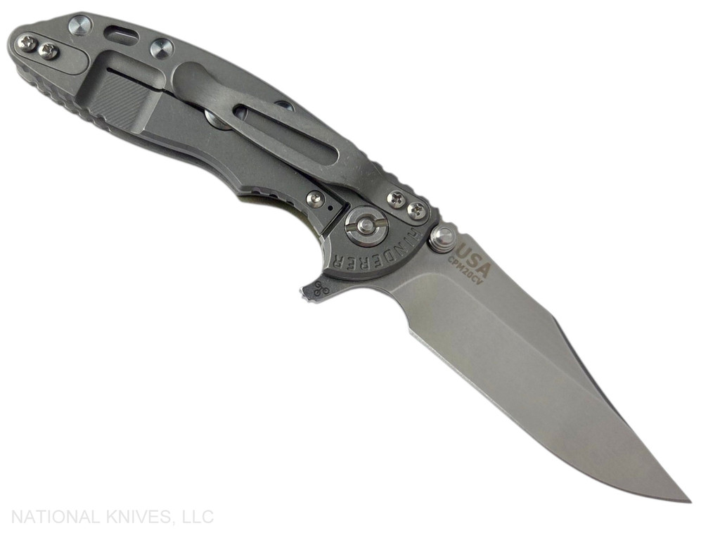 Rick Hinderer Knives XM-18 3.0" Bowie folding knife with thumb stud and flipper tab - shown open lock side.  Stonewash 20CV stainless steel plain edge blade.  OD green G-10 handle with Working Finish lock side.  Model KXM30BOW.