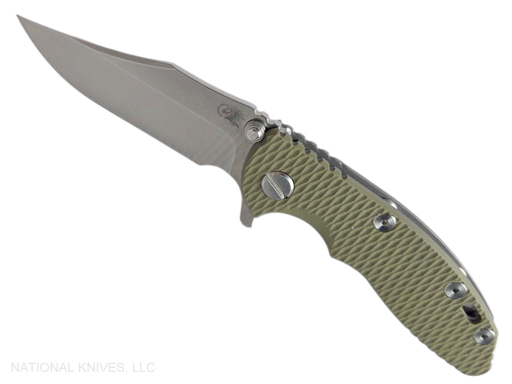 Rick Hinderer Knives XM-18 3.0" Bowie folding knife with thumb stud and flipper tab - shown open presentation side.  Stonewash 20CV stainless steel plain edge blade.  OD green G-10 handle with Working Finish lock side.  Model KXM30BOW.