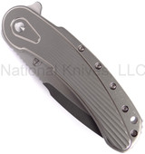 Todd Begg Knives Bodega 2.0 folding knife with flipper tab - shown closed presentation side.  2-tone N690 stainless steel plain edge blade.  Gray titanium handle.
For reference only.