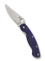 Spyderco Military folding knife with thumb hole - shown open presentation side.  Satin S110V stainless steel plain edge blade.  Dark Blue G-10 handle.  Model C36GPDBL.