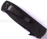 Emerson Knives CQC-7AW BT folding knife with thumb disk and Emerson Wave opener - shown closed pocket clip side.  Black 154CM stainless steel plain edge blade.  Black G-10 handle.  Model CQC-7AW-BT.
For reference only.