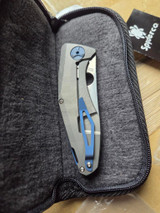 Used Spyderco Drunken folding knife with thumb hole - knife resting in pouch shown.  Satin S90V stainless steel plain edge blade.  Black carbon fiber handle with titanium lock side.  Model C235CFTIP.