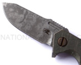 Rick Hinderer Knives Battle Field Pickup Half Track folding knife with flipper tab - close up of presentation side blade.  S35VN stainless steel plain edge blade.  Smooth titanium handle.  Model K20090SPBF.
For reference only.