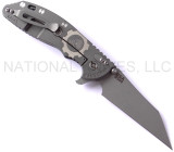 Rick Hinderer Knives Gearhead XM-24 Wharncliffe folding knife with thumb stud and flipper tab - shown open lock side.  Working Finish M390 stainless steel plain edge blade.  Black G-10 handle with Working Finish lock side.  Model K3023SGW00.
For reference only.