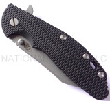 Rick Hinderer Knives Gearhead XM-24 Wharncliffe folding knife with thumb stud and flipper tab - shown closed presentation side.  Working Finish M390 stainless steel plain edge blade.  Black G-10 handle with Working Finish lock side.  Model K3023SGW00.
For reference only.