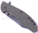 Rick Hinderer Knives Battlefield Pickup XM-24 Wharncliffe folding knife with thumb stud and flipper tab - shown closed presentation side.  M390 stainless steel plain edge blade.  OD green G-10 handle with titanium lock side.  Model K30230SPBF.
For reference only.