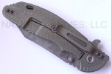 Rick Hinderer Knives Battlefield Pickup XM-24 Wharncliffe folding knife with thumb stud and flipper tab - shown closed lock side.  M390 stainless steel plain edge blade.  OD green G-10 handle with titanium lock side.  Model K30230SPBF.
For reference only.