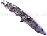 Rick Hinderer Knives Digi Camo Edition Eklipse Harpoon Tanto folding knife with thumb stud and flipper tab - shown open lock side.  Working Finish 20CV stainless steel plain edge blade.  OD green G-10 handle with Battle Bronze lock side.  Model K40042S000.
For reference only.