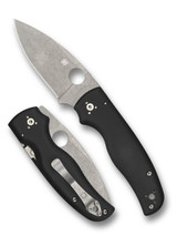Spyderco Shaman folding knife with thumb hole - shown open presentation side and closed pocket clip side.  Stonewash S30V stainless steel plain edge blade.  Black G-10 handle.  Model C229GP.
