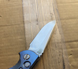 USED Rick Hinderer Knives XM-18 Automatic Spearpoint knife with push button - close up of presentation side blade shown.  Stonewash 20CV stainless steel plain edge blade.  Anodized blue titanium handle. 