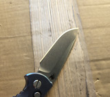 USED Rick Hinderer Knives XM-18 Automatic Spearpoint knife with push button - close up of presentation side blade shown.  Stonewash 20CV stainless steel plain edge blade.  Anodized blue titanium handle. 