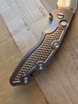 USED Rick Hinderer Knives XM-18 Automatic Spearpoint knife with push button - close up of presentation side handle shown.  Stonewash 20CV stainless steel plain edge blade.  Anodized bronze titanium handle. 