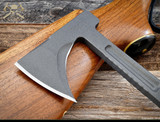 RMJ Tactical Kestrel Trail tomahawk - close up of head.  Tungsten Cerakote 80CRV2 steel plain edge head.  Dirty Olive G-10 handle.
For reference only.