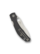Spyderco Kapara folding knife with thumb hole and flipper - shown closed pocket clip side.  Satin S30V stainless steel plain edge blade.  Black carbon fiber handle.  Model C241CFP.
