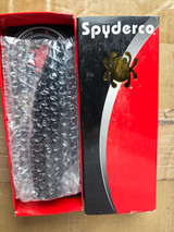 Used Spyderco Police folding knife with thumb hole - sleeve and tray with knife and paperwork in tray shown.  Black VG-10 stainless steel plain edge blade.  Black stainless steel handle.  Model C07BKP.