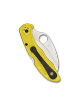 Spyderco Tasman Salt 2 folding knife with thumb hole - shown closed pocket clip side.  Satin H-2 stainless steel serrated edge blade.  Yellow FRN handle.  Model C106SYL2.