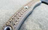 RMJ Tactical Little Bird 18 camp style axe - close up of obverse handle shown.  Tungsten Cerakote 52100 steel plain edge head.  Hyena Brown G-10 handle.
For reference only. RMJ Tactical Little Bird 18 camp style axe - close up of obverse handle shown.  Tungsten Cerakote 52100 steel plain edge head.  Hyena Brown G-10 handle.
For reference only.