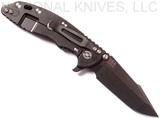 Rick Hinderer Knives XM-18 3.5" Harpoon Spanto folding knife with thumb stud and flipper tab - shown open lock side.  Black stonewash S35VN stainless steel plain edge blade.  Black G-10 handle with stonewash black lock side.  Model K2552SGD00.