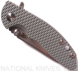 Rick Hinderer Knives Skinny XM-18 Slicer folding knife with thumb studs and flipper tab - shown closed presentation side.  Stonewash 20CV stainless steel plain edge blade.  Grey G-10 handle with stonewash lock.  Model K1011SSGS00.