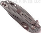Rick Hinderer Knives Skinny XM-18 Slicer folding knife with thumb studs and flipper tab - shown close pocket clip side.  Stonewash 20CV stainless steel plain edge blade.  Grey G-10 handle with stonewash lock.  Model K1011SSGS00.